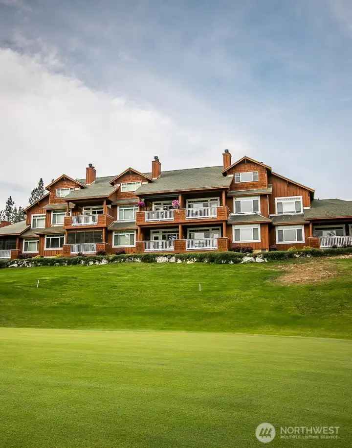 Building A from the 18th green. Unit 104 deck is on the ground floor 2nd from left with epic views