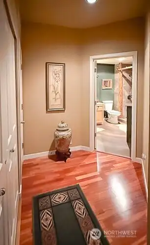 Hallway w/Laundry and furnace on left, bathroom entrance