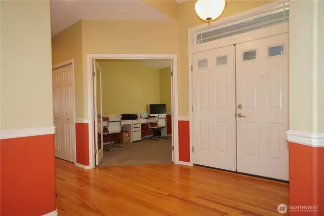 Foyer, front doors and entrance to den