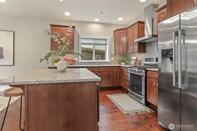 Another view of the kitchen.  Gas cooking and a touchless faucet.
