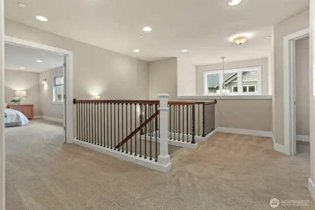 Upstairs is large and has 4 generously sized bedrooms including the primary suite (shown to the left), an additional bathroom and a conveniently located washer/dryer room.