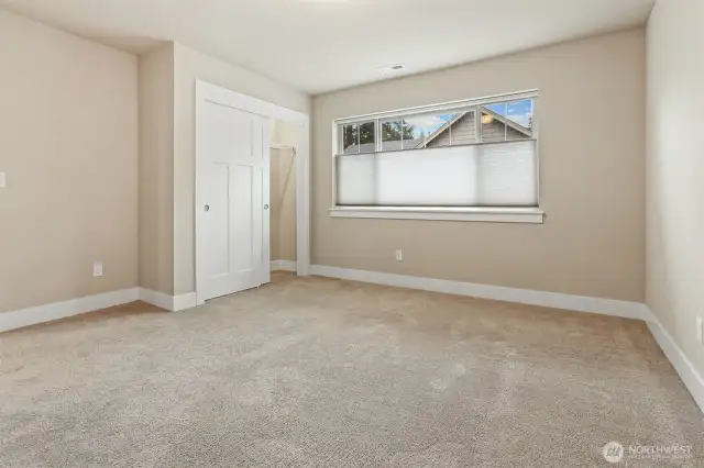This is the first of four bedrooms on the upper level of this beautiful home.  Top-down/bottom/up shades in every room.