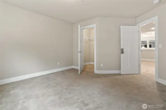 The third bedroom on the upper floor also has a walk-in closet and top/down/bottom/up shades.