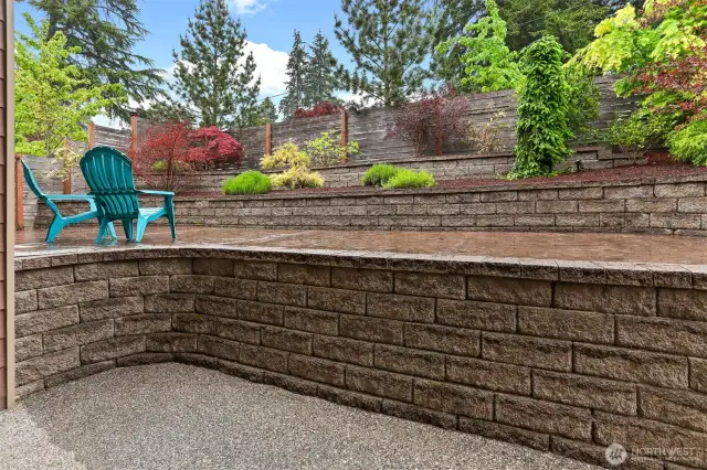 Terraced landscaping out of the glass sliders off of the dining area on the main level.