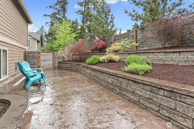 The patio is reached either through the glass sliders or through the gate.