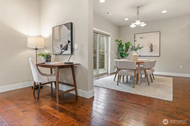 Looking from the living room to the dining area which has glass sliders that open up to the back patio.