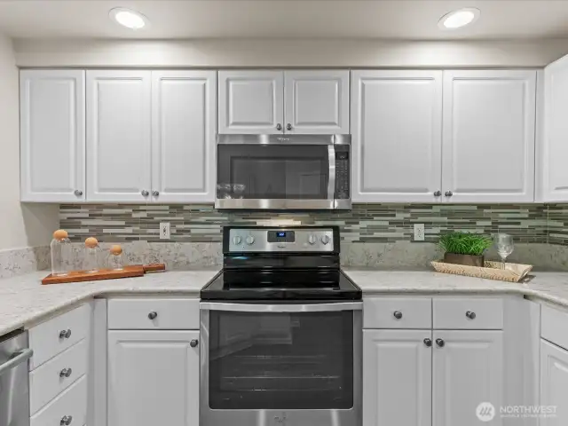 Kitchen offers lots of cabinets, stainless steel appliances and pantry closet.