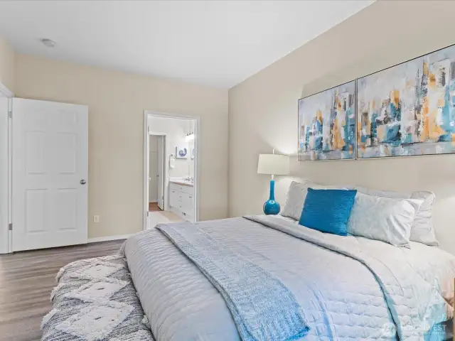 Primary Bedroom with ensuite double vanity full bath, and walk-in closet.