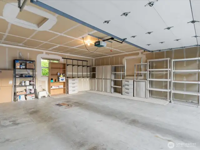 This unit also features a private large 2-car garage, including storage shelves.