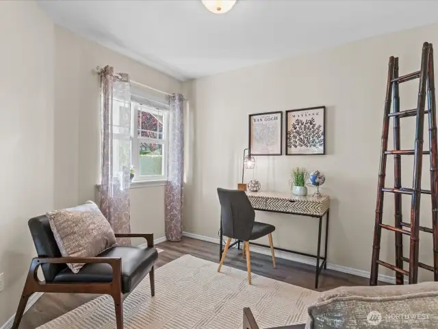 Offic area is light and bright with sunny window and french doors that open to main living area.