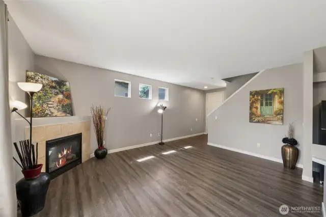 A spacious Great Room with a cozy Fireplace