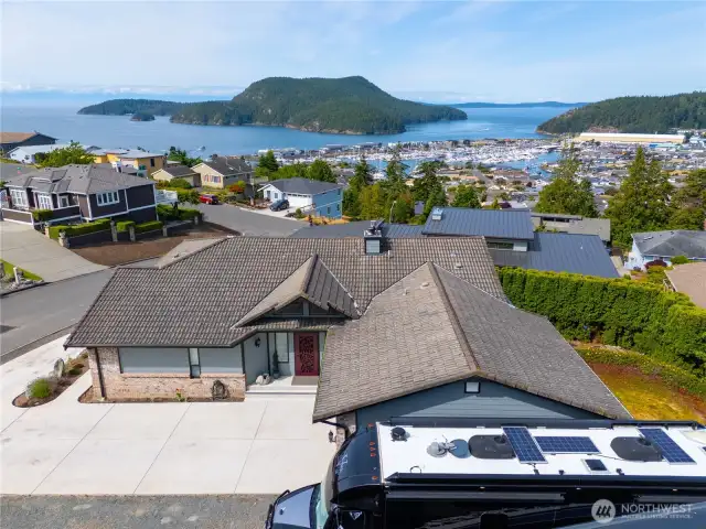 Overlooking spectacular Burrows Island and Burrows Bay as well as the Olympics. You can load your RV or boat right from your own driveway and be off on adventures in just minutes! This motorhome is 45' long including the motorcycle lift. There is plenty of room in front for a boat!