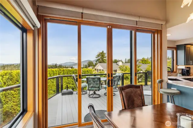 Walls of windows lead from the dining room to the deck for outdoor entertaining!