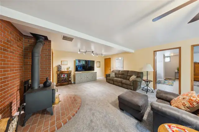 Spacious family room with wood burning fireplace.