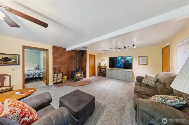 Downstairs offers a spacious family room, 2 bedrooms and a bathroom plus a mud room.