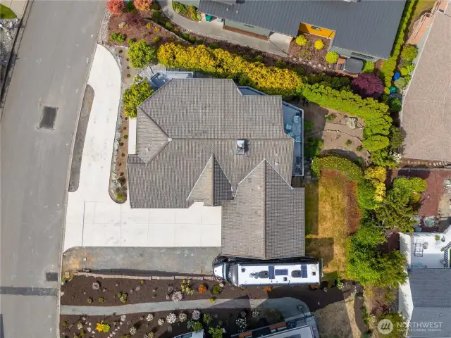 Aerial showing the whole property, all the off street parking and RV parking space, and grassy space for pets.