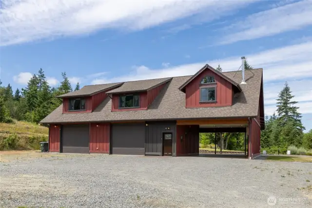 No detail was spared in the construction of this home. The expansive driveway and parking area easily accommodate multiple vehicles, with ample space for turning around. The oversized carport features striking exposed beams, 50-amp electrical service, and an abundance of ceiling lighting—perfect for functionality.
