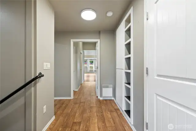 To the left is the main entrance, with a walk-in storage closet located on the right. Each living space features separate doors with keyed entry for privacy and security. Heating options throughout the home include a free-standing wood stove, radiant wall heat, and three mini-splits equipped w/a heat pump for efficient climate control.