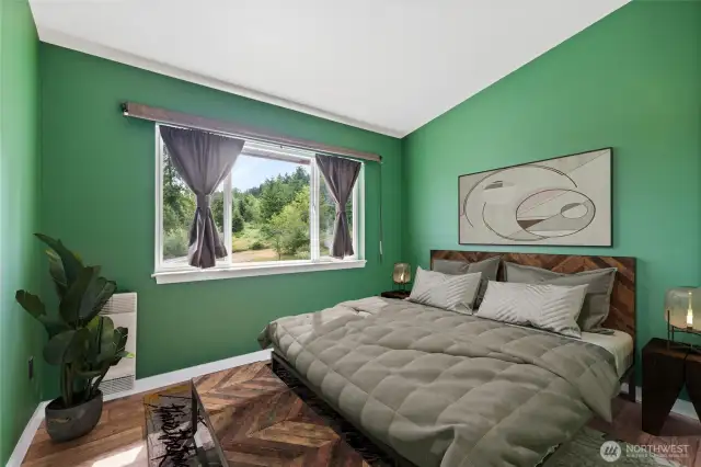 Bedroom #1 features beautiful territorial views, a spacious closet, and a mini-split system for heating and air conditioning.