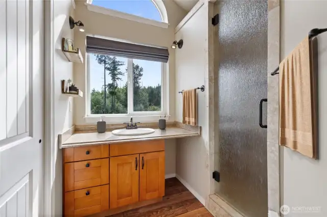 Attached bath, spacious closet on left. Storage on side of cabinet and lots of natural light pour in!