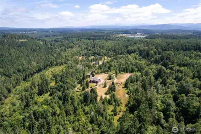 Set on over 20 acres, this expansive property boasts a breathtaking forest reserve, access to serene lakes, picturesque trails, and abundant wildlife—an ideal retreat for nature lovers and outdoor enthusiasts.