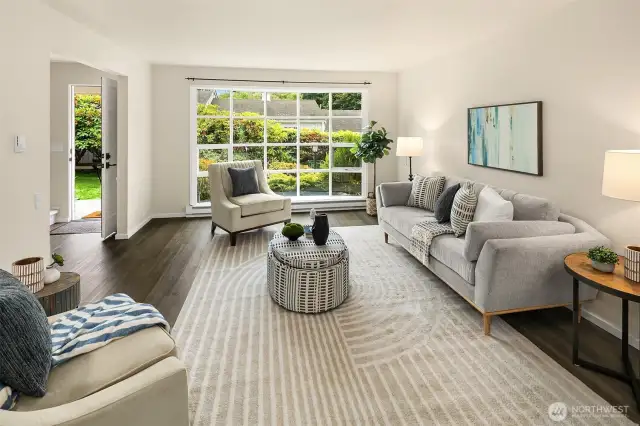 Expansive south-facing bay window fills the space with warm natural light.