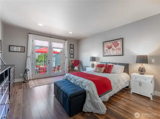 Primary bedroom with french doors to rear patio
