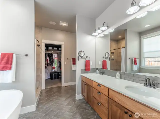 Dual sinks. Herringbone tile flooring