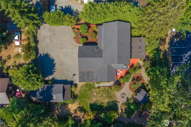 A fully fenced compound with multiple outbuildings