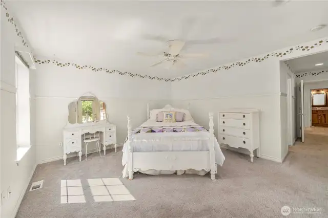 Main floor primary bedroom with attached bathroom & closet