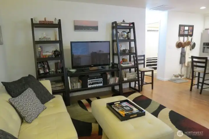 Living room toward kitchen and hall to bath and bedrooms.  This small home lives big!  New floors throughout.