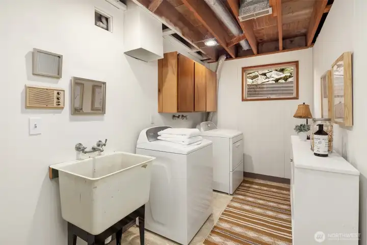 Laundry room downstairs with fresh paint.