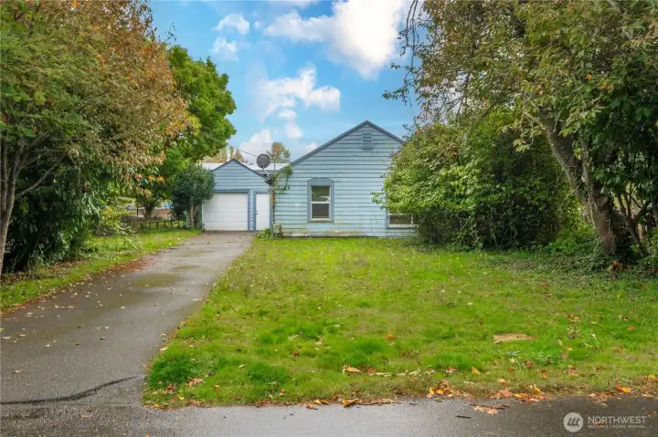 Set back home and detached garage