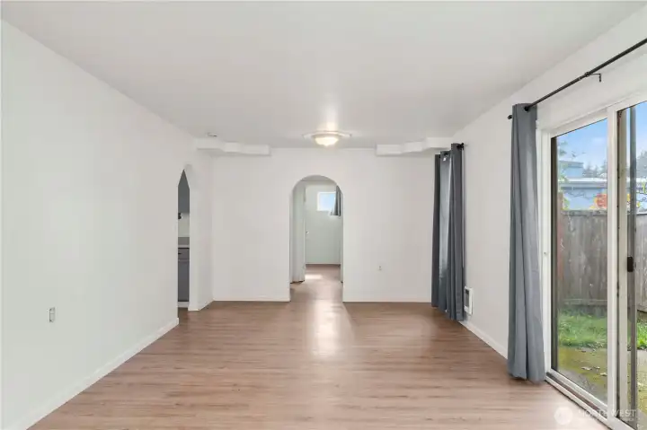 ok back to the main living area looking towards the primary and kitchen is on the left. Great space for a dining room