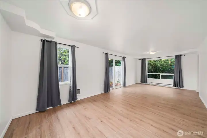 Light and bright in the main living area. Slider opens to private patio on the side yard