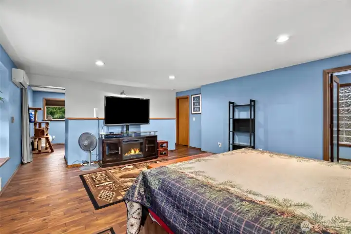 Loft/den attached to the primary bedroom has its own covered deck patio on top