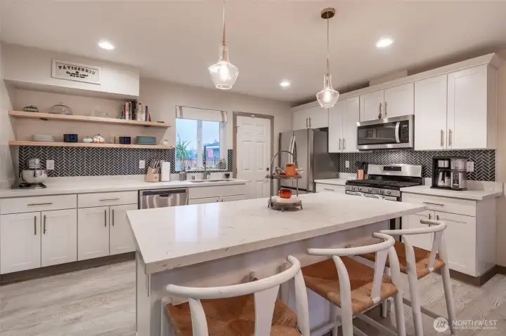 Quartz countertops, SS appliances, soft close cabinets, gas stove/range