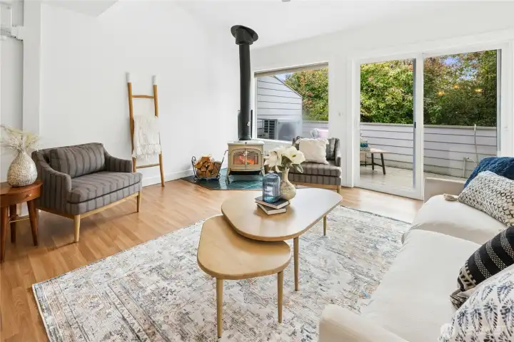 The sliding glass door leads out onto the south-facing deck. A wood stove is perfect for cozy winter evenings!