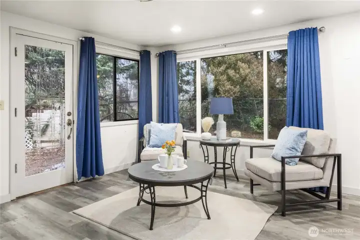Light and bright family room with a door to the backyard.