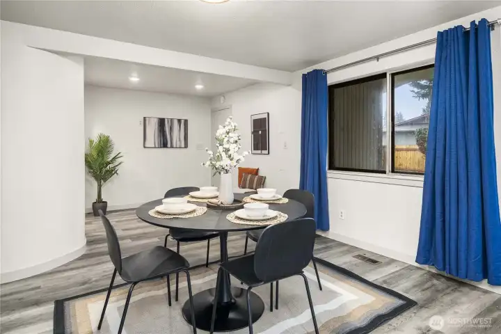 Beyond the dining room is the entrance to the mud room, laundry room, and shop