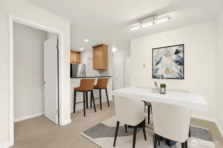 Dining Area flowing into the eat-in kitchen  *this photo is virtually staged*
