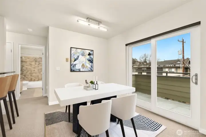 Dining Area with sliding glass door to balcony - enjoy views at each meal. *this photo is virtually staged*