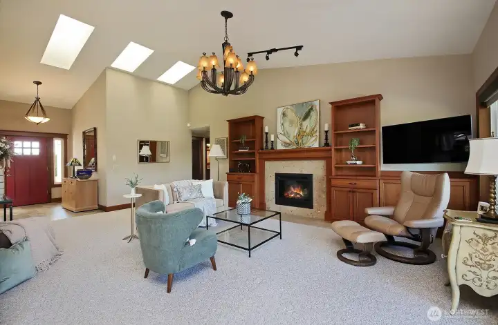 lots of space and light in this living room with propane fireplace