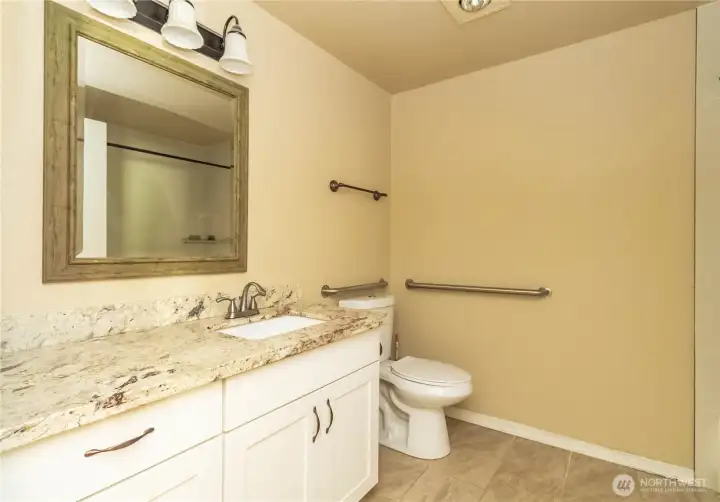 Tile tub surround and flooring make this a cozy and warm bathroom