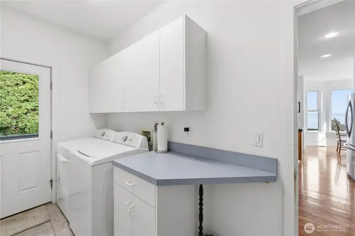 The convenient laundry room is located just off the kitchen. The dog bath station is off camera to the left.  There is also a walk-in pantry + cleaning supplies closet in this room.
