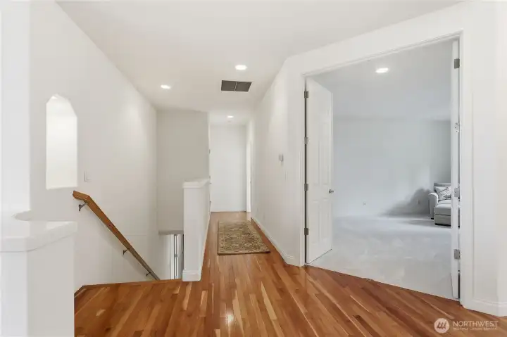 Hall off the living room facing the library and guest room.