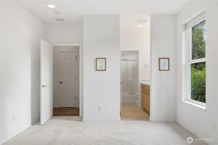 At the end of the main level hall is a peaceful ensuite guest room.