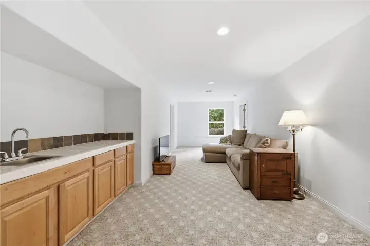 Lower level rec room includes a wet bar and a tremendous amount of storage (three large closets off camera to the right).