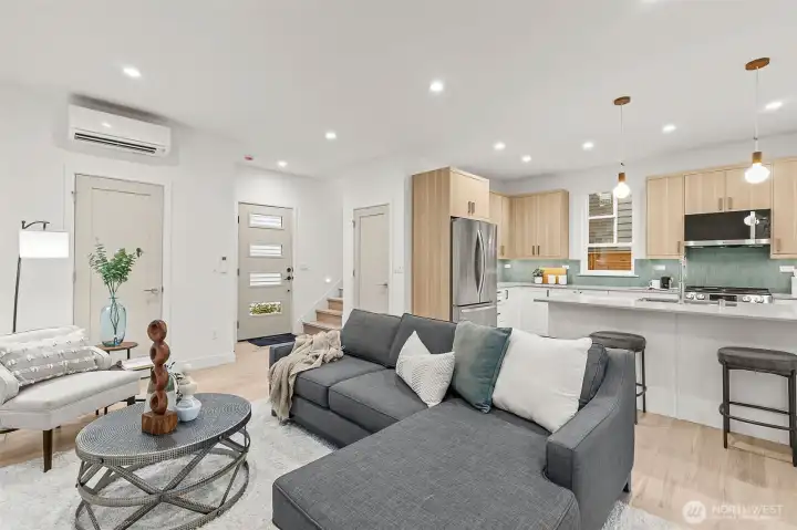 comfortable living room, dining, and kitchen