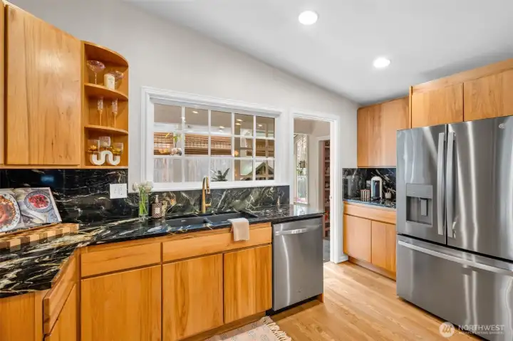 The kitchen flows easily into the adjoining sunroom and BRAND NEW full butler's pantry.